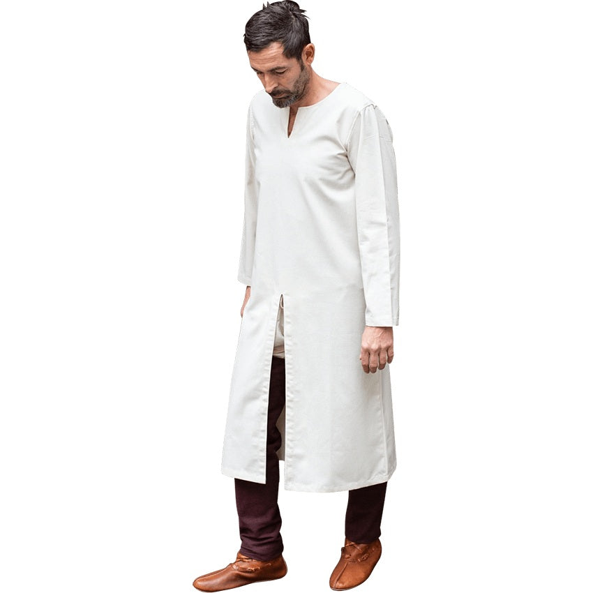 Long sleeve natural colored undertunic against white background.