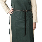 A man wearing a green medieval tunic and a long medieval belt made of black leather.