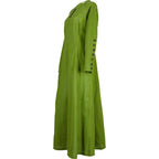 Jovina Linen Dress in Moss Green, side view, ankle length with buttoned sleeve