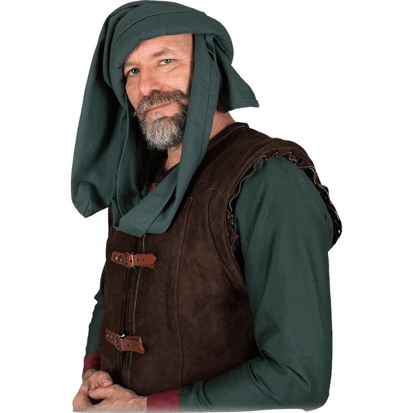 A man wearing a medieval-style costume with a dark green hooded tunic and a brown suede-like vest with leather straps, photographed against a plain white background.