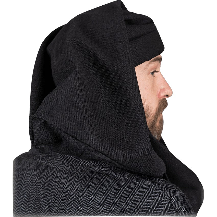 A close-up side profile of a man wearing a black hooded garment with a dark gray herringbone-patterned lower section, isolated on a white background.
