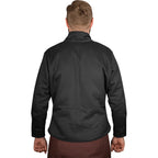 A man viewed from the back wearing a black long-sleeve jacket and brown trousers against a plain white background.