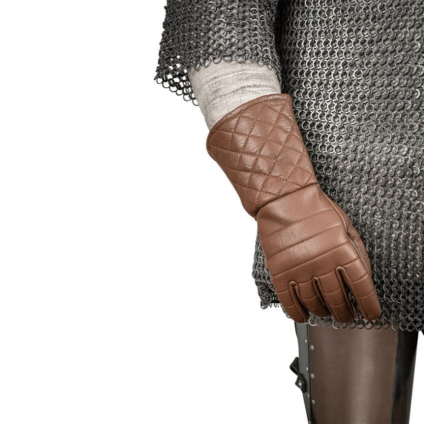 A brown quilted leather glove worn on a person's arm, shown against a white background with chainmail armor and a tunic visible.