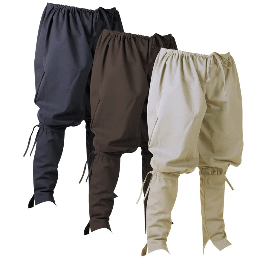 Three pairs of loose-fitting drawstring harem-style pants shown overlapping on a white background, in dark navy, dark brown, and light beige.