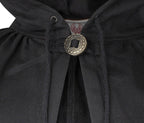 Close-up of a black hooded garment with a large round metallic button closure at the neck.