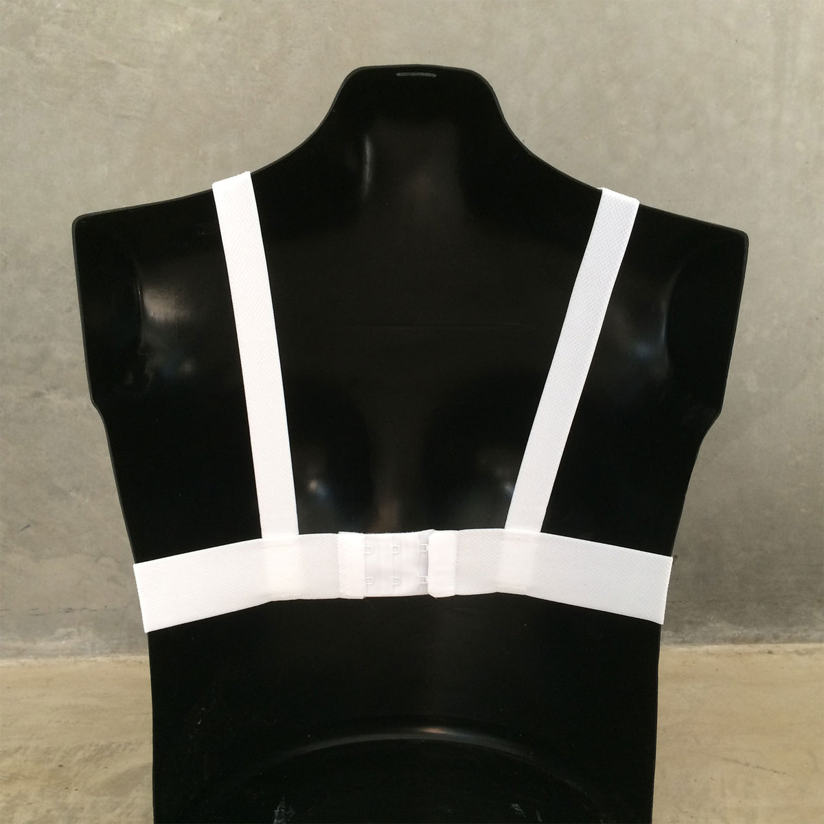 Back detail showing straps of QP Sport women's chest protector.