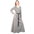 A woman modeling a long-sleeved gray tunic dress with a dark brown belt, set against a plain white background.