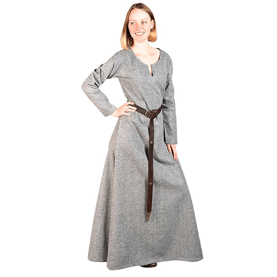 A woman modeling a long-sleeved gray tunic dress with a dark brown belt, set against a plain white background.